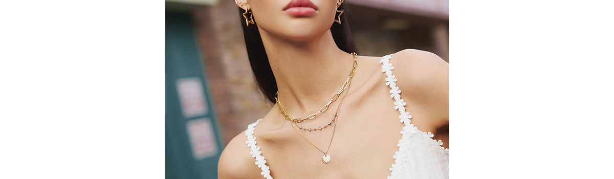 Ania Haie Sunny Sparklers necklaces for cool girls, showcasing luminous gold and cubic zirconia sparkling, perfectly capturing sunlight.  